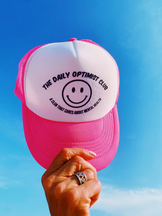 The Daily Optimist Club Trucker Hat in Pink